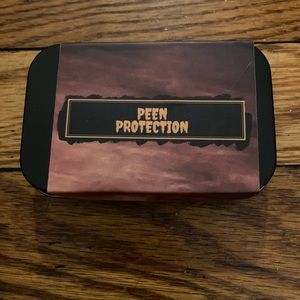 Black tin stash container peen protection design